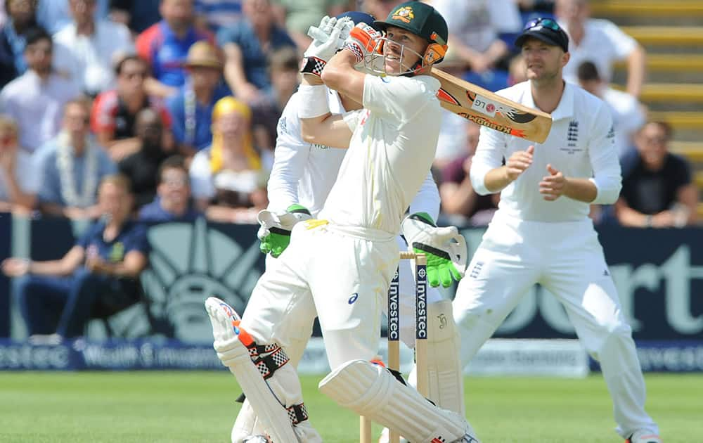 Australia’s David Warner plays a shot during day four of the first Ashes Test cricket match, in Cardiff, Wales.