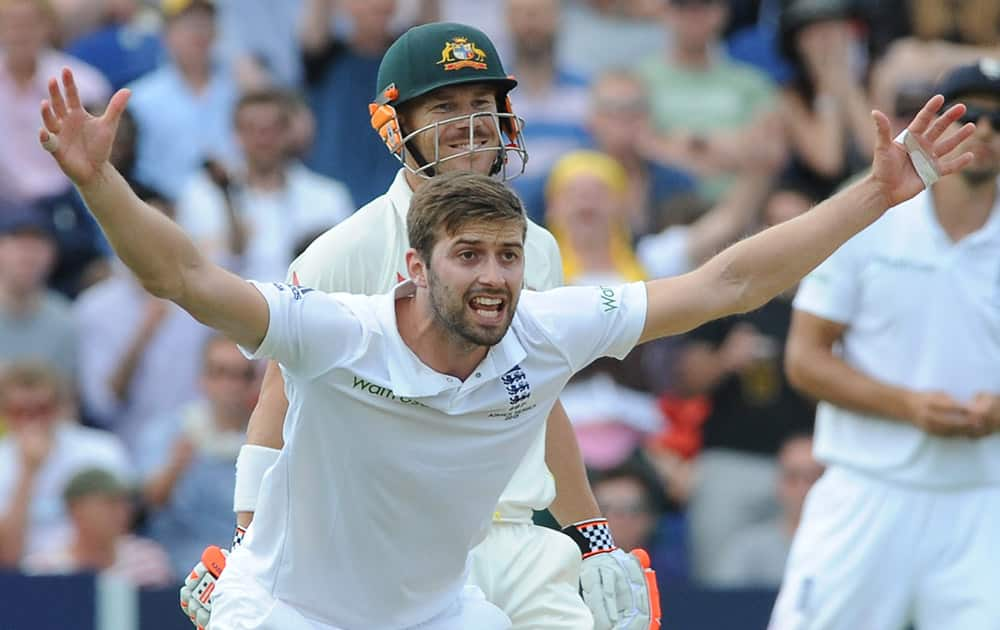 Unsuccessful LBW appeal by England’s Mark Wood for Australia’s David Warner during day four of the first Ashes Test cricket match, in Cardiff, Wales.