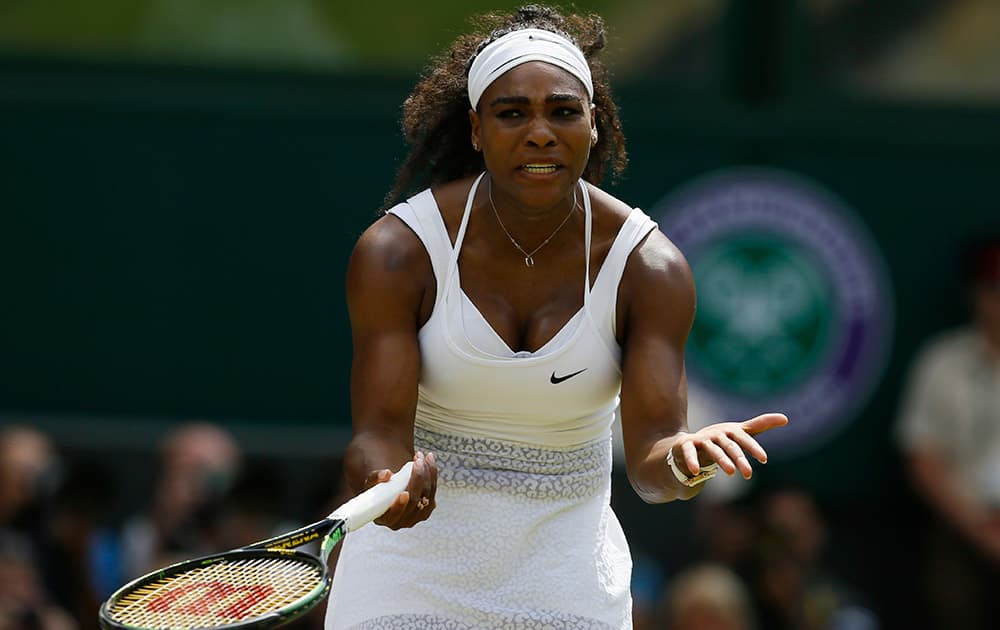 Serena Williams of the United States gestures between points during the women's singles final against Garbine Muguruza of Spain, at the All England Lawn Tennis Championships in Wimbledon, London.