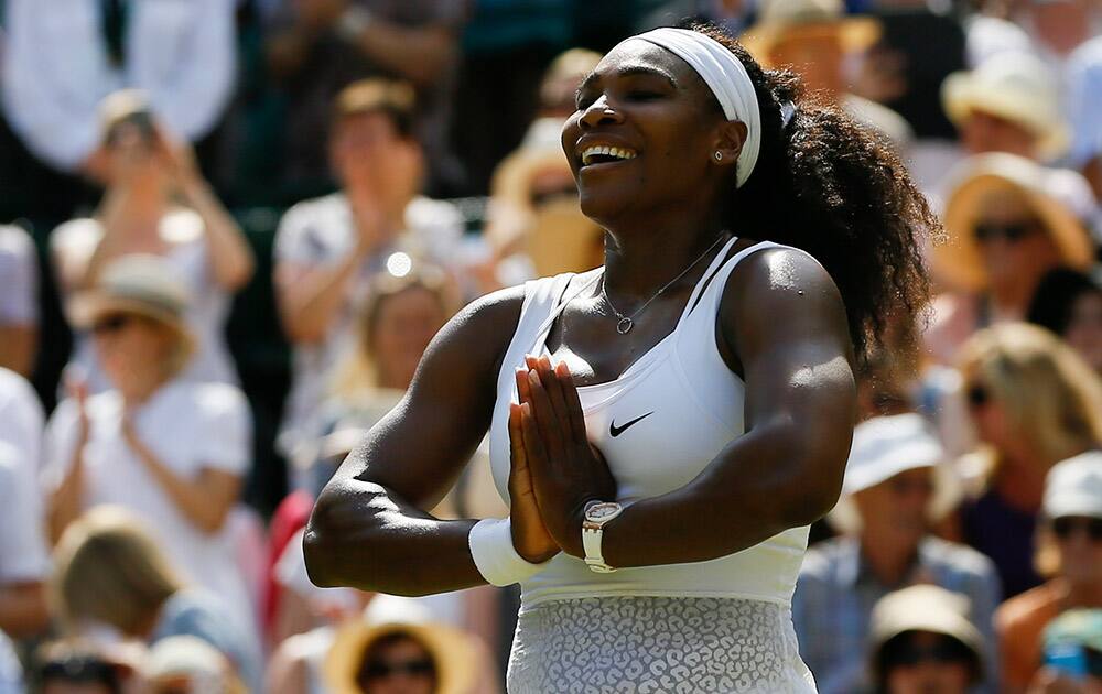 Serena Williams of the United States gestures after winning the singles match Garbine Muguruza of Spain after the women's singles final at the All England Lawn Tennis Championships in Wimbledon, London. Williams won 6-4, 6-4. 