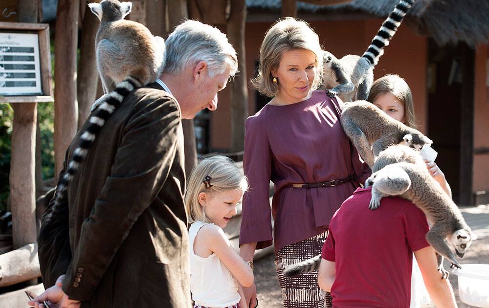 Belgium's King Philippe, left, and his wife Queen Mathilde, center, visit the Lemur's at Park Pairi Daiza in Brugelette, Belgium.