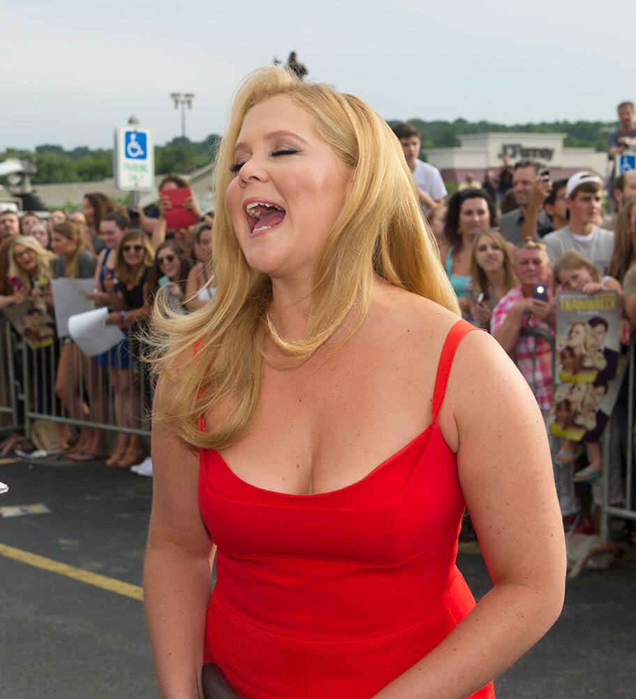 Actress Amy Schumer reacts to a question as she talks to reporters at a special screening of the new comedy, 