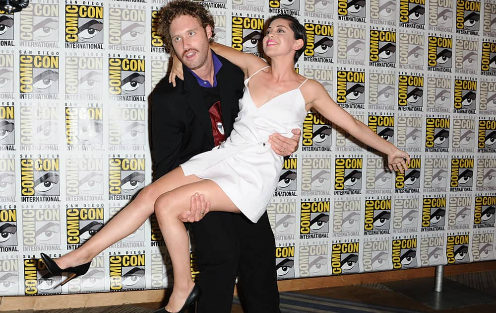 TJ Miller, background, and Rosa Salazar attend the 20th Century Fox press line on day 3 of Comic-Con International in San Diego. 