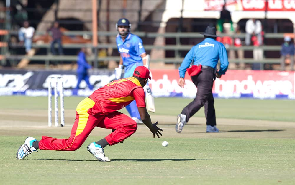 Zimbabwean captain Elton Chigumbura stops the ball in the second one-day international cricket match against India in Harare, Zimbabwe.