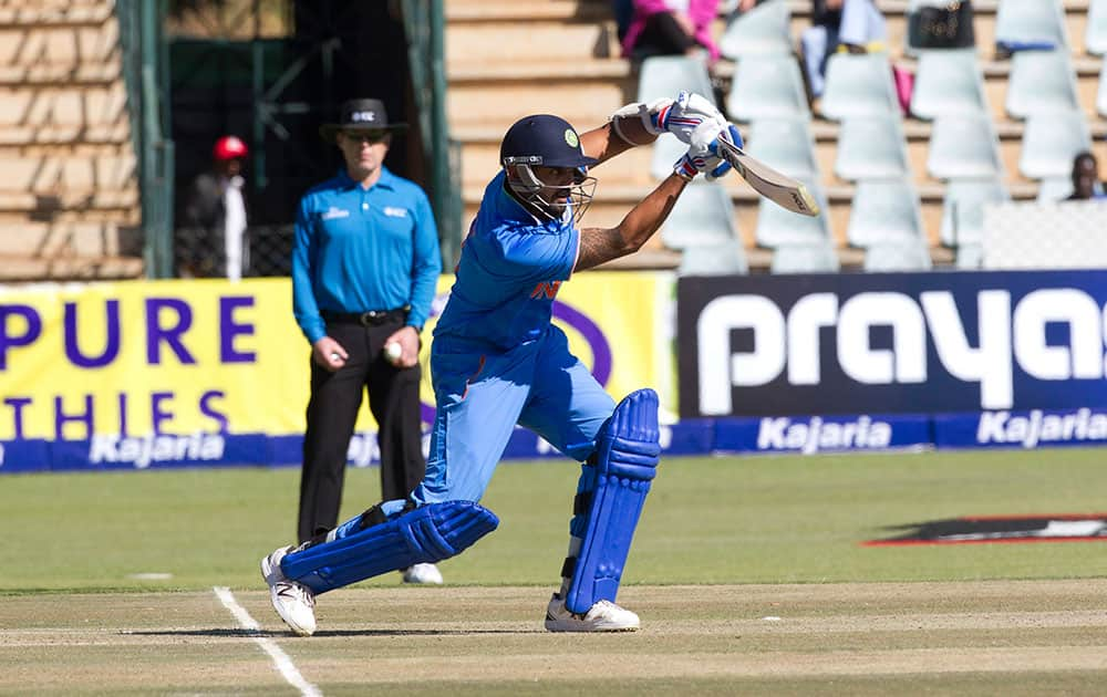 Indian batsman Murali Vijay drives a shot in the second one-day international cricket match against Zimbabwe in Harare, Zimbabwe.