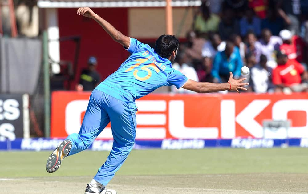 Indian bowler Bhuvneshwar Kumar reaches to stop the ball, during the second One Day International cricket match against Zimbabwe in Harare, Zimbabwe.