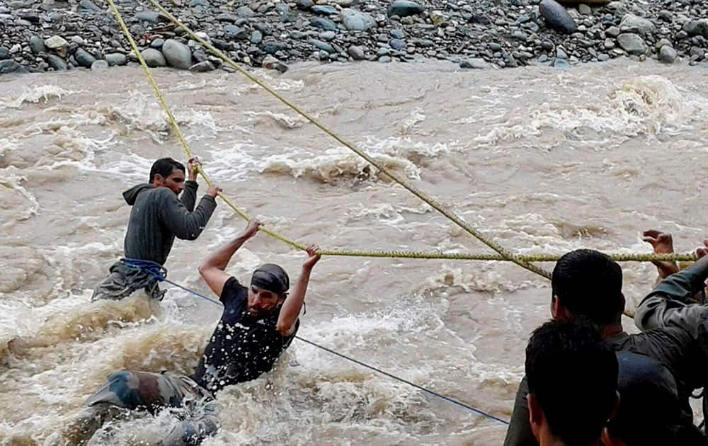 Army rescue people from the flood hit area at Kulgam district of south Kashmir.