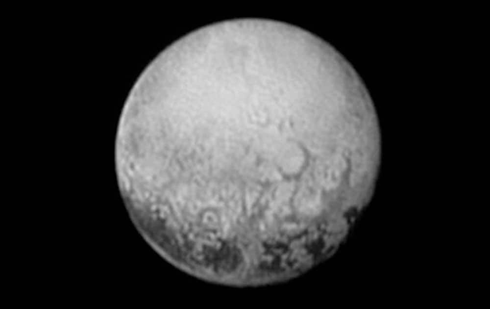 This image provided by NASA shows Pluto from the New Horizons spacecraft. On Tuesday, July 14, NASA's New Horizons spacecraft will come closest to Pluto. New Horizons has traveled 3 billion miles over 9½ years to get to the historic point.