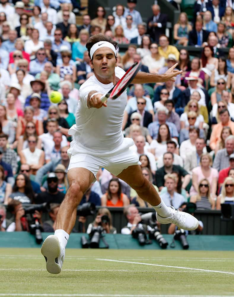 Roger Federer of Switzerland returns a ball to Novak Djokovic of Serbia during the men's singles final at the All England Lawn Tennis Championships in Wimbledon, London.