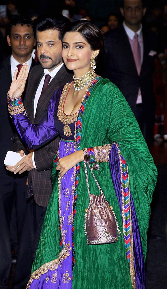Bollywood actor Sonam Kapoor along with her father Anil Kapoor attends Shahid Kapoors wedding reception in Mumbai.