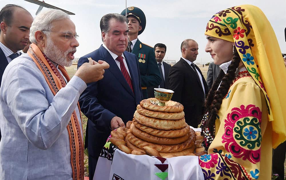 Prime Minister Narendra Modi gets a traditional welcome on his arrival for a visit to the India-Tajik Friendship Hospital (ITFH) in Quarghanteppa in Tajikistan.