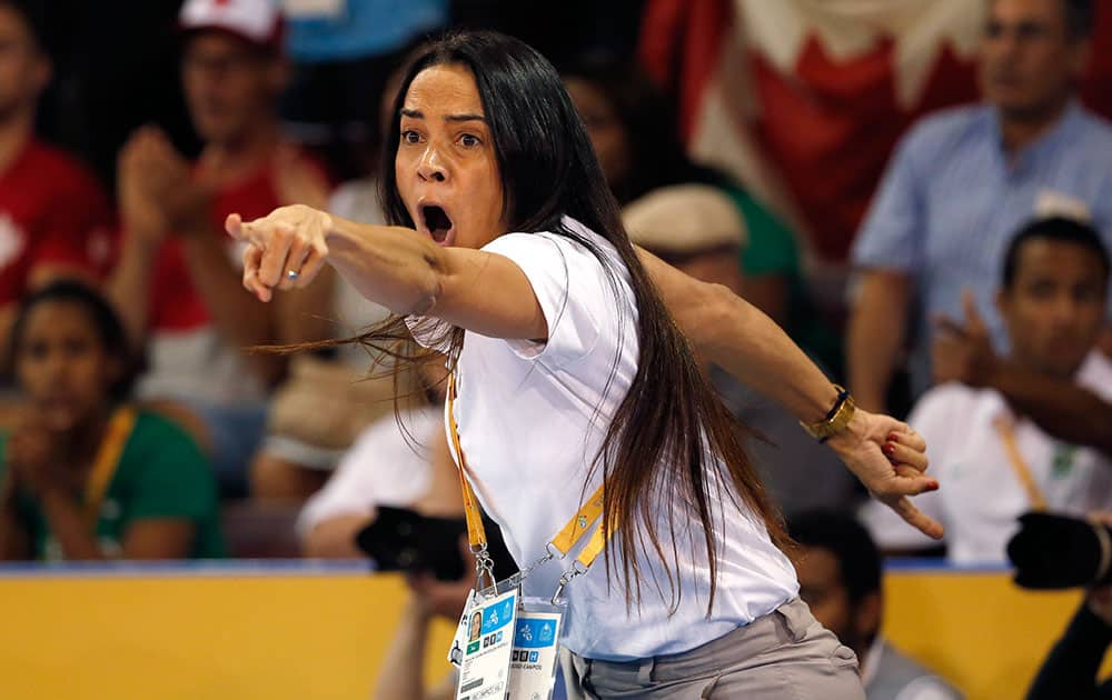 Brazil judo coach Rosicleia Campos reacts during a women's -70kg match between Brazil's Maria Portela and Canada's Kelita Zupancic at the Pan Am Games, in Mississauga, Ontario.