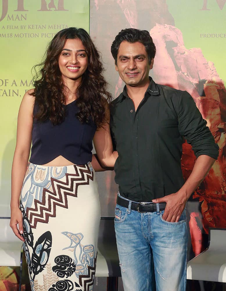 Bollywood actors Nawazuddin Siddiqui, right and Radhika Apte pose during the trailer launch of their film “Manjhi –The Mountain Man” in Mumbai.