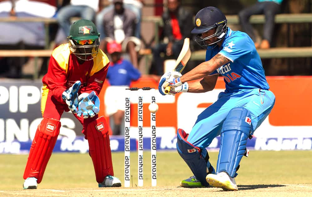 Manish Pandey plays a shot as Zimbabwean wicketkeeper prepares to catch the ball during the third One Day International cricket match against Zimbabwe in Harare, Zimbabwe.