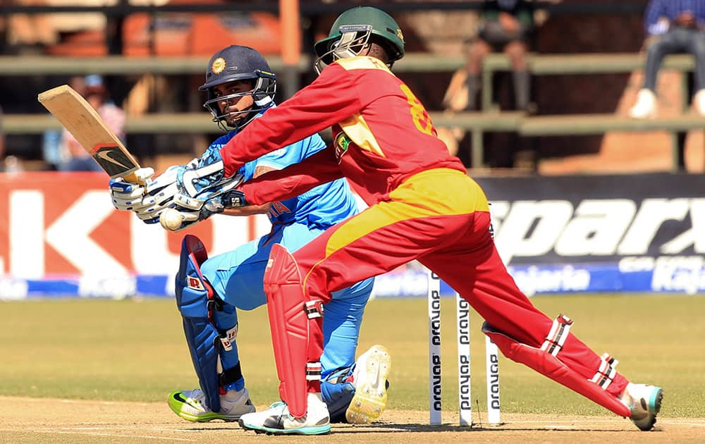 Manish Pandey plays a shot as Zimbabwean wicketkeeper fails to stop the ball during the third One Day International cricket match against Zimbabwe in Harare, Zimbabwe.