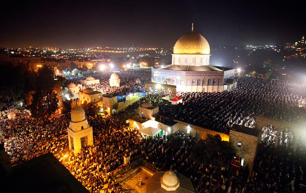 Palestinian Muslim worshippers pray during Laylat Al Qadr, also known as the Night of Power, in the Al Aqsa Mosque compound in Jerusalem's Old City.