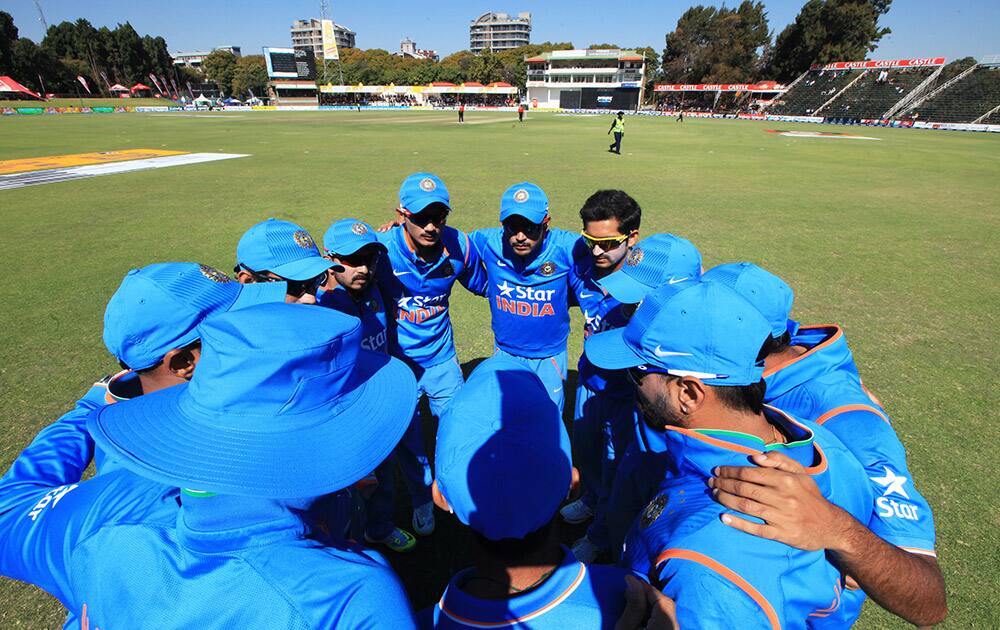 Indian cricket players huddle together before going on to the pitch for their One Day International cricket match against Zimbabwe in Harare, Zimbabwe.