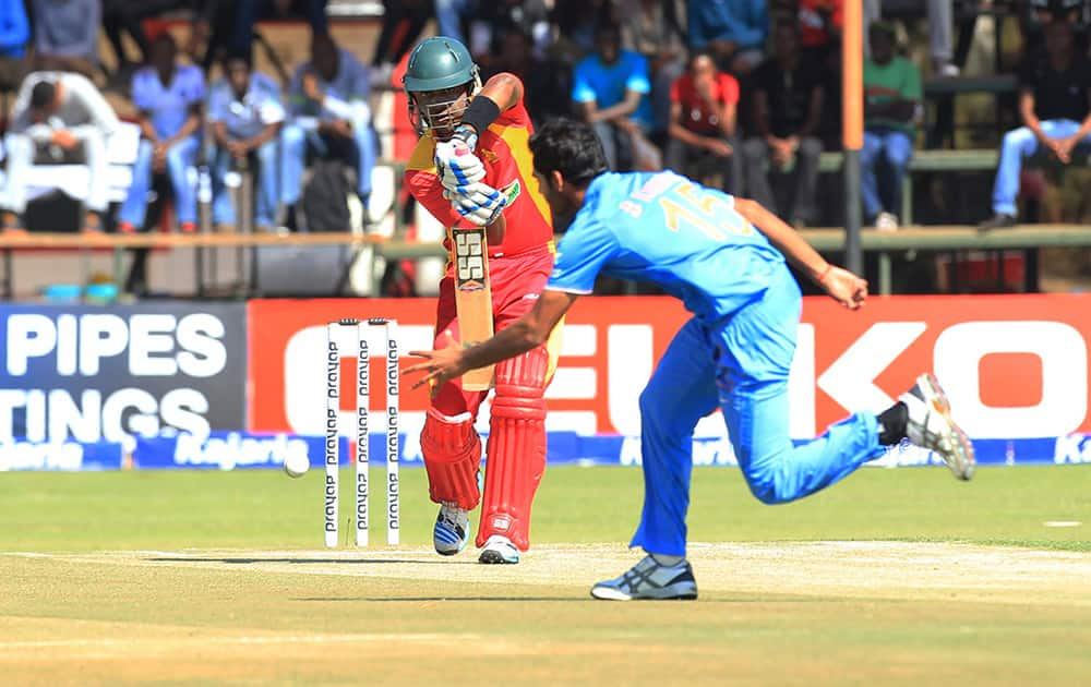 Chamunorwa Chibhabha plays a shot to Bhuveneshwar Kumar during the third One Day International cricket match against India in Harare, Zimbabwe.