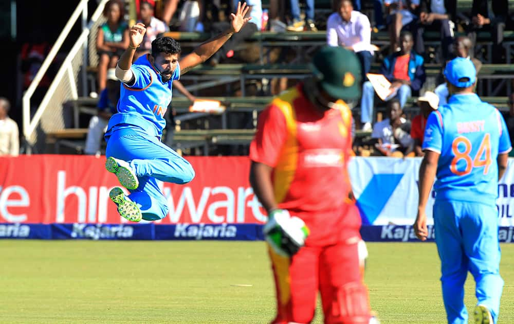 Murali Vijay celebrates the wicket of Zimbabwean batsman Regis Chakabva during their One Day International cricket match in Harare, Zimbabwe.