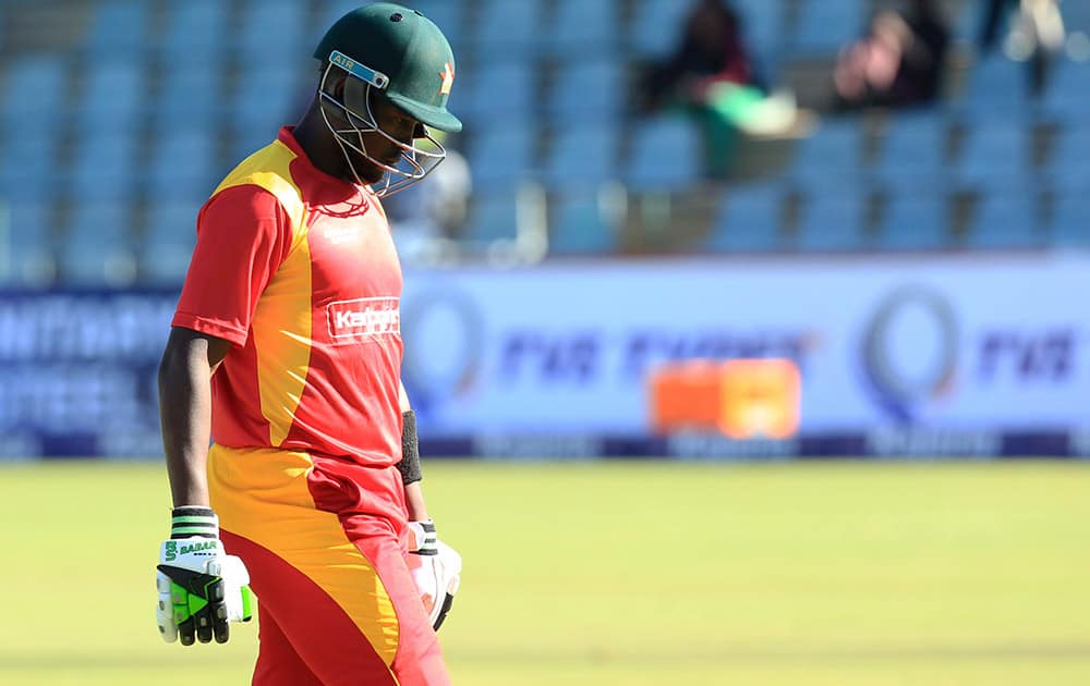 Zimbabwean captain Elon Chigumbura walks off the pitch after been dismissed during the One Day International cricket match against India in Harare, Zimbabwe.