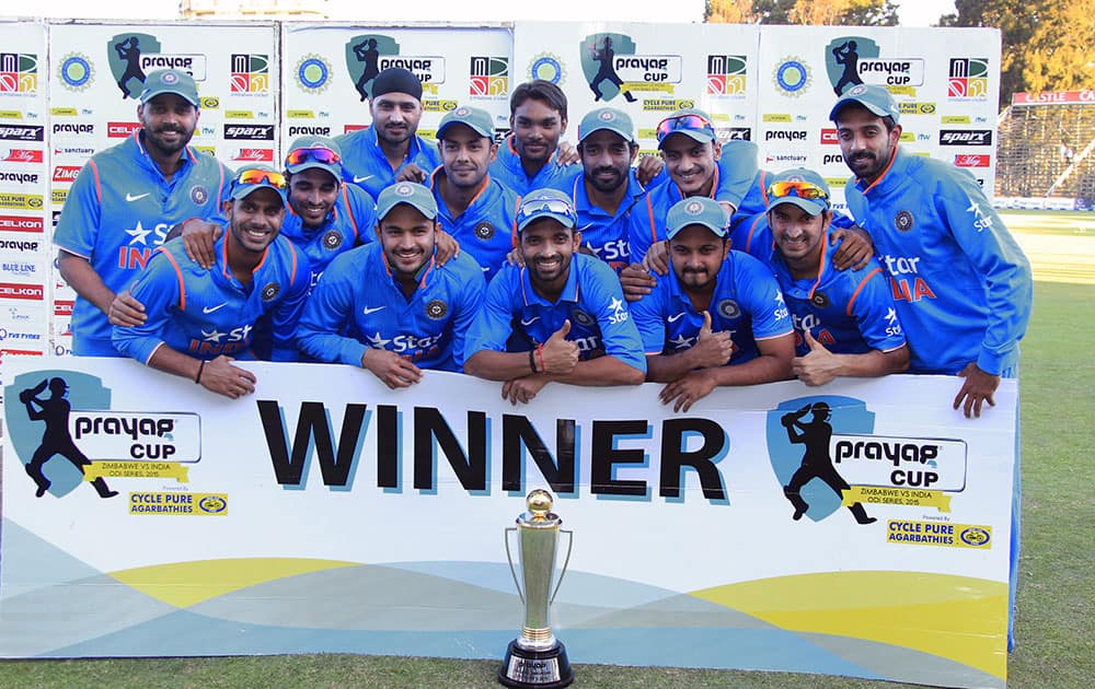 Indian cricketers pose with the trophy after they won the One Day International cricket match series against Zimbabwe in Harare, Zimbabwe.