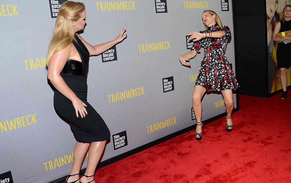 Actors Amy Schumer, left, and Leslie Mann attend the world premiere of 