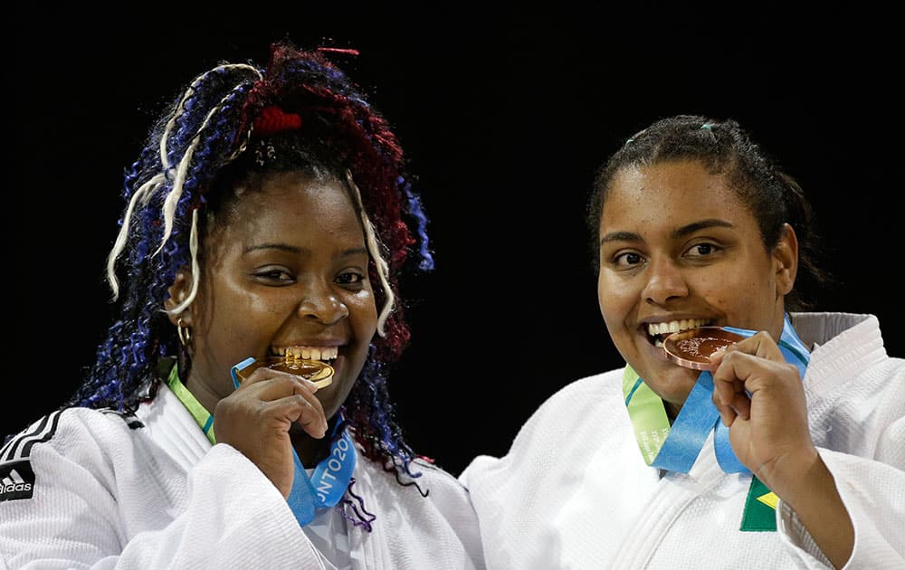 Gold medalist Cuba's Idalys Ortiz, left, and Bronze medalist Brazil's Maria Sullen Altheman pose with their medals earned in the women's +78kg judo competition at the Pan Am Games in Mississauga, Ontario.