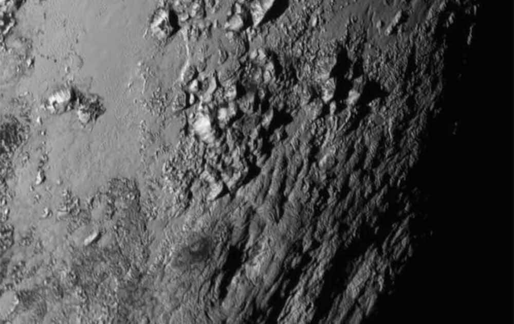 This image provided by NASA on Wednesday shows a region near Pluto's equator with a range of mountains captured by the New Horizons spacecraft.