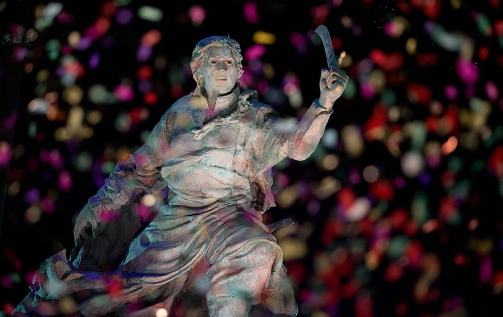 Confetti rains on the newly unveiled statue of Bolivian Juana Azurduy de Padilla, behind the government house in Buenos Aires, Argentina.