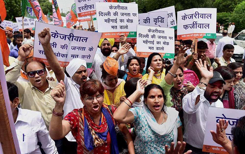  Delhi BJP workers shout slogans during a protest against Kejriwal governments decision to increase Value Added Tax on petrol and diesel, in New Delhi.