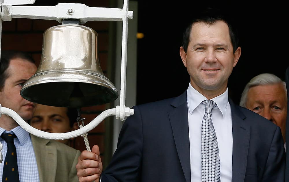 Former Australian cricket team captain Ricky Ponting rings the bell to signify five minutes to the start of play on the first day of the second Ashes Test match between England and Australia, at Lord's cricket ground in London.