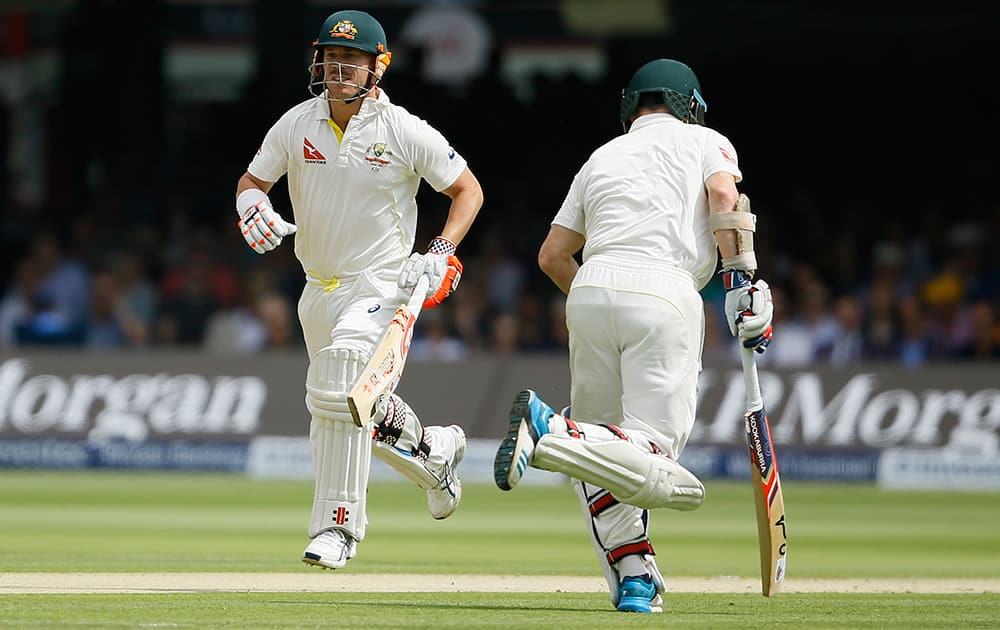 Australia's David Warner and Chris Rogers add runs on the first day of the second Ashes Test match between England and Australia, at Lord's cricket ground in London.