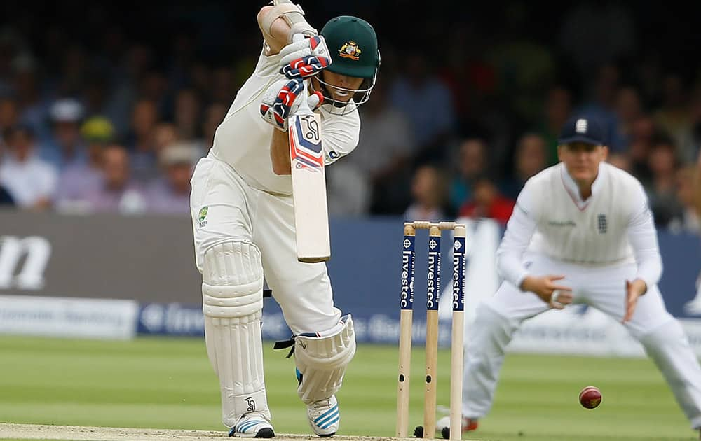 Australia's Chris Rogers plays a shot off the bowling of England's James Anderson on the first day of the second Ashes Test match between England and Australia, at Lord's cricket ground in London.