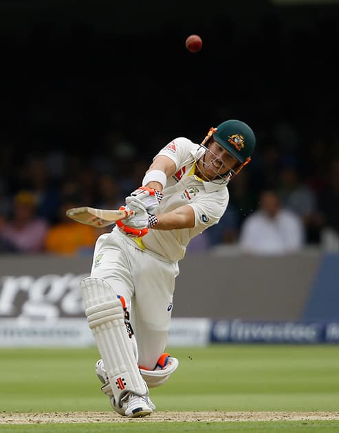 Australia's David Warner plays a shot off the bowling of England's Moeen Ali, which was caught by James Anderson on the first day of the second Ashes Test match between England and Australia, at Lord's cricket ground in London.