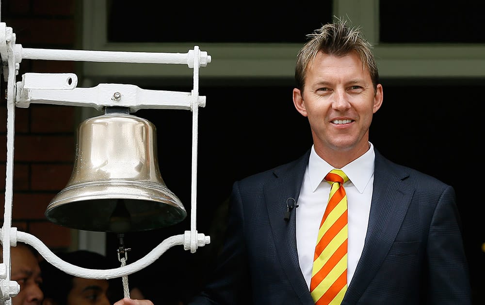 Former Australian cricket team player Brett Lee rings the bell to signify five minutes to the start of play on the second day of the second Ashes Test match between England and Australia, at Lord's cricket ground in London.