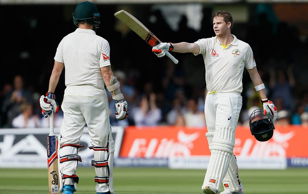 Australia's Steven Smith, celebrates with Chris Rogers after scoring a century on the first day of the second Ashes Test match between England and Australia, at Lord's cricket ground in London