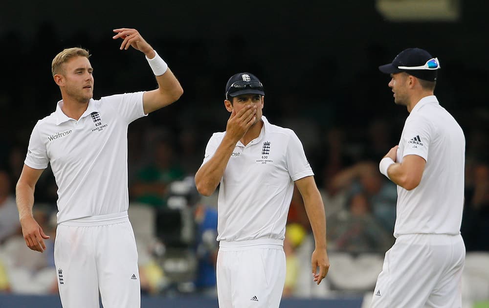 England's captain Alastair Cook with Stuart Broad and James Anderson as Australia ad runs on the first day of the second Ashes Test match between England and Australia, at Lord's cricket ground in London.