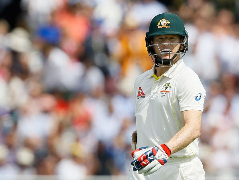 Australia's Chris Rogers leaves the pitch after being bowled by England's Stuart Broad on the second day of the second Ashes Test match between England and Australia, at Lord's cricket ground in London.