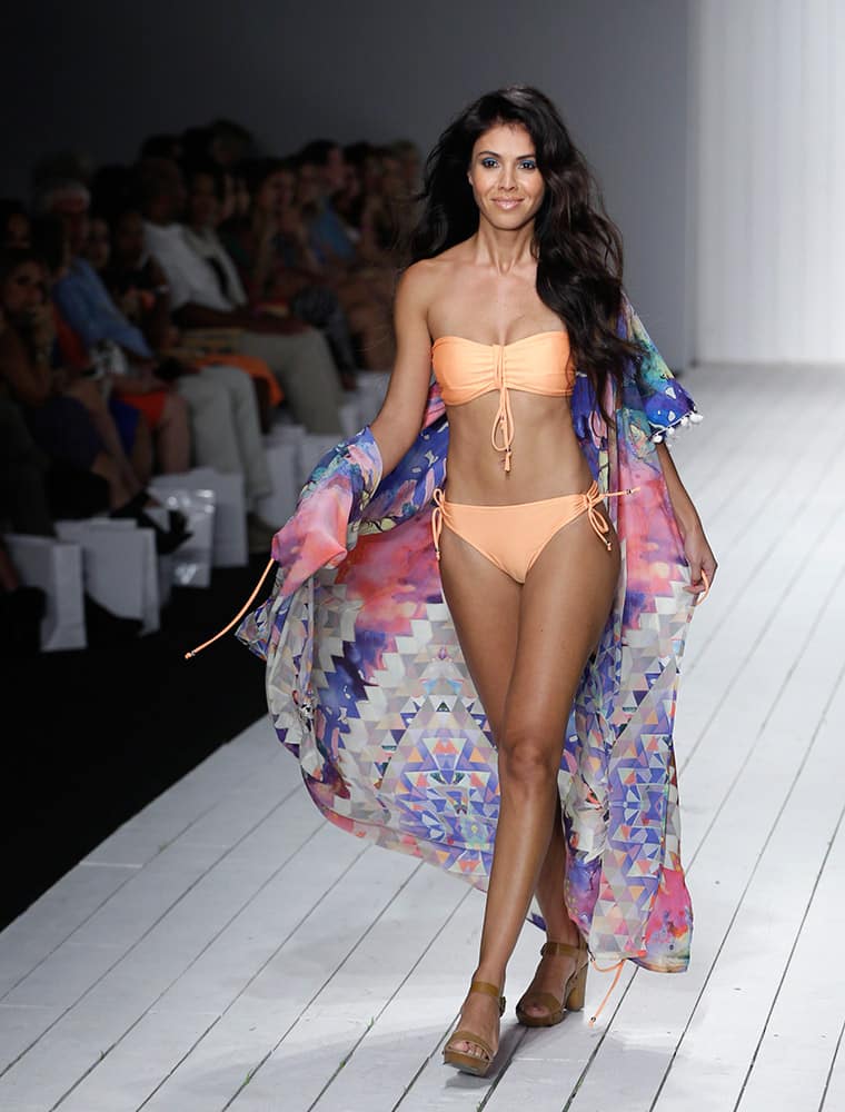 A model walks down the runway during the Robb & Lulu swimwear show as part of Funkshion Fashion Week Swim in Miami Beach, Fla.