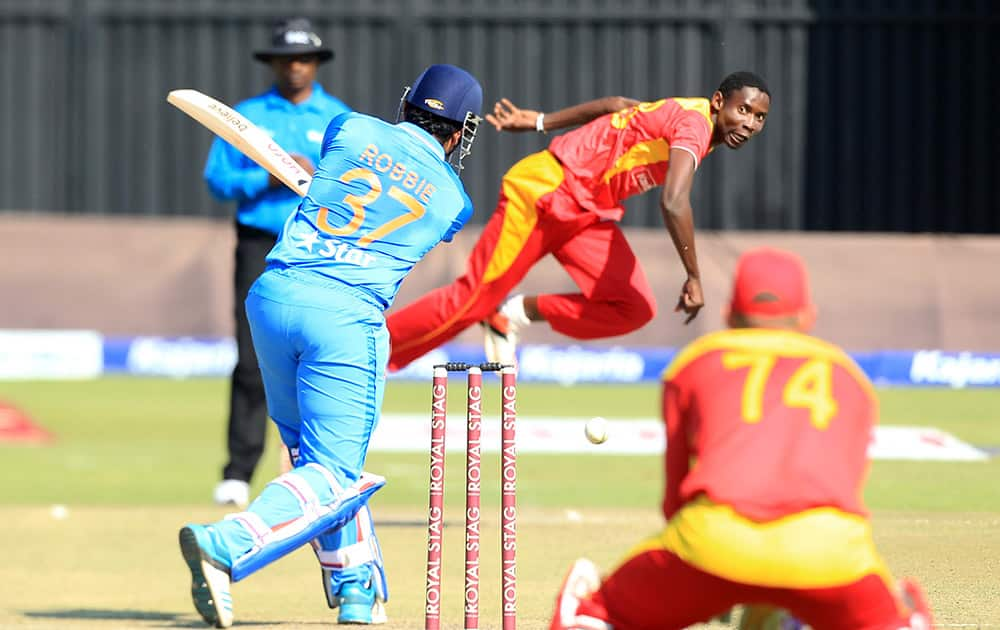 Zimbabwean bowler Christopher Mpofu bowls to Indian batsman Robin Uthappa on the first day of the Twenty20 cricket match against India in Harare, Zimbabwe.