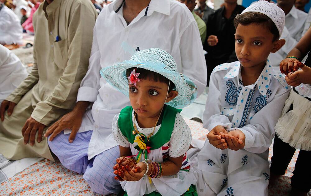 Muslim children offer prayers at Eidgah during Eid al-Fitr in Allahabad.