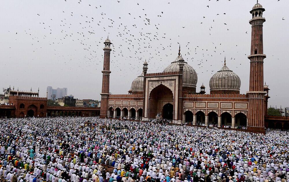 Muslims offer prayers to mark the festival of Eid al-Fitr at Jama Masjid in New Delhi.