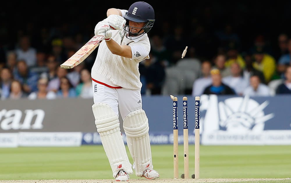 England's Gary Balance is bowled by Australia's Mitchell Johnson on the second day of the second Ashes Test match between England and Australia, at Lord's cricket ground in London.