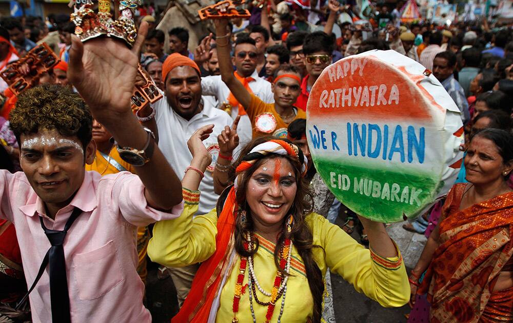 Hindu devotees dance during the “Jagannath Rath Yatra” or the chariot festival of Lord Jagannath in Ahmadabad.