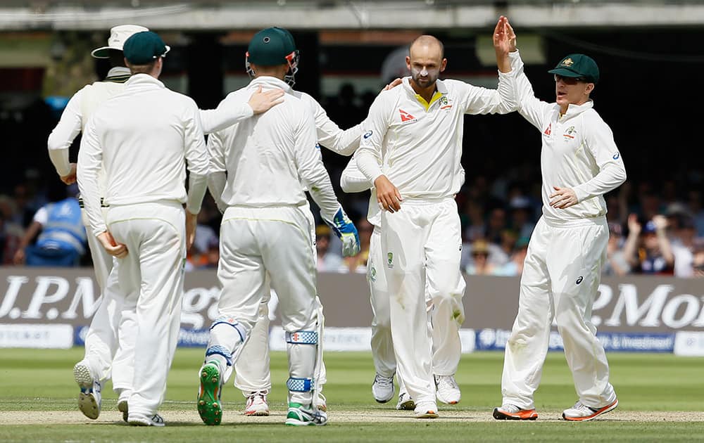 Australia's Nathan Lyon celebrates taking the wicket of England's Jos Buttler on the third day of the second Ashes Test match between England and Australia, at Lord's cricket ground in London.