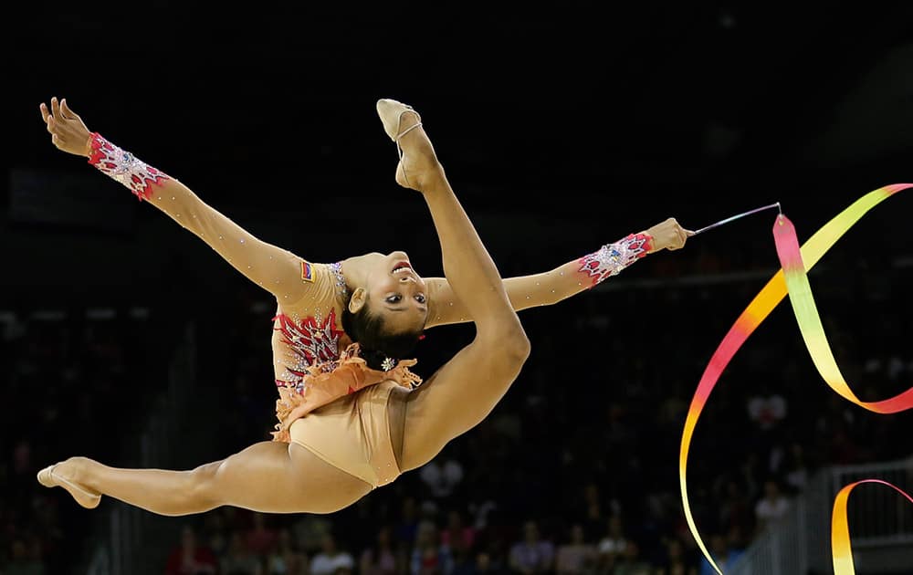 Venezuela's Grisbel Lopez performs with the ribbon during individual all-around rhythmic gymnastics competition in the Pan Am Games in Toronto.