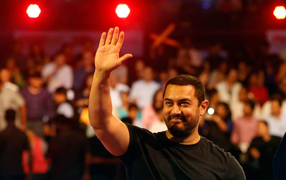 Aamir Khan waves to the crowd as he attends the inaugural session of Pro-Kabaddi League 2015.