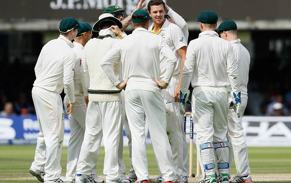 Australia's Josh Hazlewood celebrates taking the wicket of England's Moeen Ali on the third day of the second Ashes Test match between England and Australia, at Lord's cricket ground in London