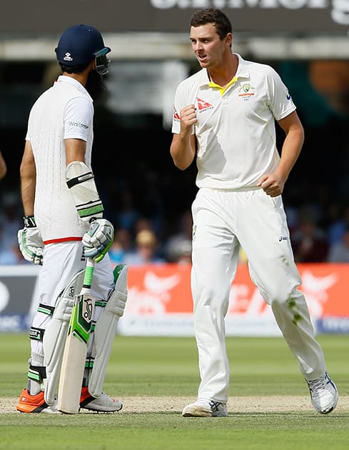 Australia's Josh Hazlewood celebrates taking the wicket of England's Moeen Ali on the third day of the second Ashes Test match between England and Australia, at Lord's cricket ground in London.