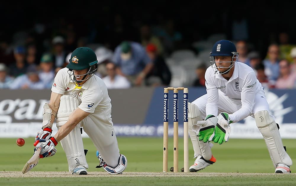 Australia's Chris Rogers plays a shot off the bowling of England's Moeen Ali on the third day of the second Ashes Test match between England and Australia, at Lord's cricket ground in London.